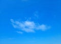 Small Wispy Cloud in Blue Sky Royalty Free Stock Photo