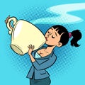 A small woman drinks a huge Cup of tea or coffee