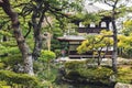 Small woman figure in Ginkakuji Temple park in Kyoto