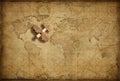 Small wood airplane over world nautical map as travel, explore and communication concept Royalty Free Stock Photo