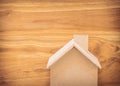 Small wood house model on brown background