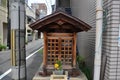 Small wood joss house or wooden little shrine on street of small