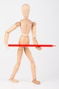 Small wood mannequin standing with pencil Royalty Free Stock Photo