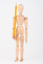 Small wood mannequin standing with pencil Royalty Free Stock Photo