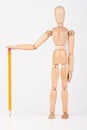 Small wood mannequin standing with pencil Royalty Free Stock Photo