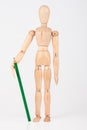 Small wood mannequin standing with pencil Royalty Free Stock Photo