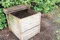 wood outdoor composting bin for recycling kitchen and garden organic waste Royalty Free Stock Photo