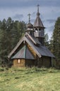 Small wooden ancient orthodox church with a dome and a cross Royalty Free Stock Photo