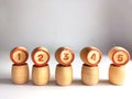 Small wooden barrels with numbers built in a row. The concept of progressive movement in achieving the goal