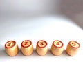 Small wooden barrels with numbers built in a row. The concept of progressive movement in achieving the goal