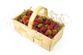 Small wooden basket full of strawberries isolated Royalty Free Stock Photo