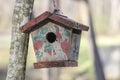 Small wooden bird house in nature Royalty Free Stock Photo