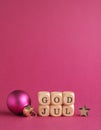 Small wooden blocks with the inscription God Jul, Scandinavian Merry Christmas, purple background Royalty Free Stock Photo