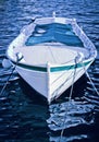 A small wooden boat anchored in the bay Royalty Free Stock Photo