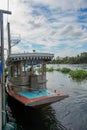 Small wooden boat as Thai local style. This boat is in a big river of Thailand. Local boat ship ferry transport stop at port pier Royalty Free Stock Photo