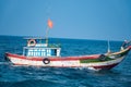 Small wooden boat fishing in the sea