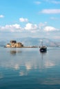 Small wooden boat transfer a group of tourists to Bourtzi island (an ancient prison). Nafplion , Greece