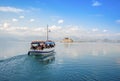 Small wooden boat transfer a group of tourists to Bourtzi island. Nafplion , Greece Royalty Free Stock Photo