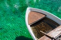 Small wooden boat in turquoise water Two ducks swimming in Lago Ghedina, an alpine lake in Cortina D`Ampezzo, Dolomites, Italy Royalty Free Stock Photo