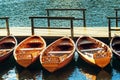 Small wooden boats docked and tied to empty pier Royalty Free Stock Photo