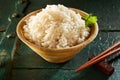 Small Wooden Bowl of White Rice with Chopsticks Royalty Free Stock Photo