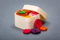 Small wooden box with colorful buttons Royalty Free Stock Photo