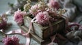 a small wooden box holds flower with a pink ribbon Royalty Free Stock Photo