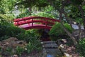 A Small Wooden Bridge Over a Stream in a Japanese Garden Royalty Free Stock Photo