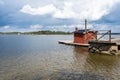 Small wooden cabin little house in the middle of the water of lake or sea bay. Bath house or sauna near the shores of the Baltic