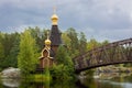 a small wooden church on a river island, the temple of the Russian Orthodox Church, Leningrad region, Priozersky district, Russia