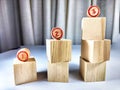 Small wooden cubes in columns, lined up in row. The concept of progressive movement in achieving the goal. Steps and Royalty Free Stock Photo