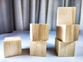 Small wooden cubes in columns, lined up in row. The concept of progressive movement in achieving the goal. Steps and Royalty Free Stock Photo