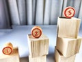 Small wooden cubes in columns, lined up in row. The concept of progressive movement in achieving the goal. Steps and Royalty Free Stock Photo