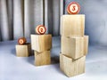 Small wooden cubes in columns, lined up in row. The concept of progressive movement in achieving the goal. Steps and Royalty Free Stock Photo