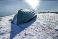 Small wooden dinghy or rowboat on a frosty bank Royalty Free Stock Photo