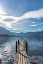 Small wooden dock entering Lake Geneva in cloudy day Royalty Free Stock Photo