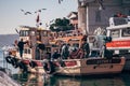 Small Wooden Fishing Boat Anchored at Pier Royalty Free Stock Photo