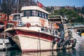 Small Wooden Fishing Boat Anchored at Pier Royalty Free Stock Photo