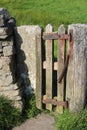 Small wooden gate, spring to close automatically Royalty Free Stock Photo