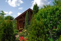 Small wooden house and the garden Royalty Free Stock Photo