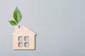 Small wooden house and green leaf Royalty Free Stock Photo