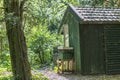 Small wooden house in the middle of at park Royalty Free Stock Photo