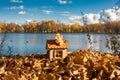 A small wooden house on the shore of a beautiful lake, building and designing eco-friendly wooden houses, dreaming of your own hom Royalty Free Stock Photo