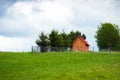 Small wooden house on the top of a hill Royalty Free Stock Photo