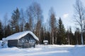 Small wooden house in winter.