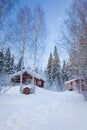 Small wooden house in winter forest