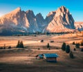 Small wooden houses in beautiful mountain valley at sunset Royalty Free Stock Photo