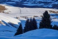 Small wooden hut at the foot of the snow-covered Tianshan Mountains in winter morning Royalty Free Stock Photo