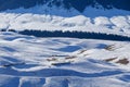 Small wooden hut at the foot of the snow-covered Tianshan Mountains in winter morning Royalty Free Stock Photo