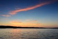 Small wooden pier on big lake at sunset Royalty Free Stock Photo